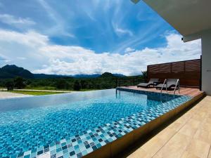 Der Swimmingpool an oder in der Nähe von Belong Jin The Dam Resort