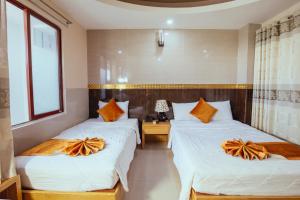 Postel nebo postele na pokoji v ubytování Oliver Hotel