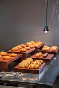 a display case with lots of different types of bread at Crowne Plaza Shenzhen World Exhibition and Convention Center, an IHG Hotel in Shenzhen