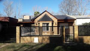 a brick house with a black roof at CASA FUNES in Funes