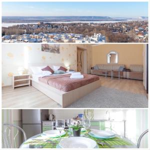 1 dormitorio con cama y vistas a la ciudad en Апартаменты RentPlaza-вид на жигулевские горы и волгу-15 этаж-24x7-дистанционно en Samara