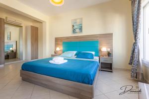 Кровать или кровати в номере Diamanti Villa, Pool & Barbecue