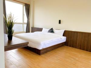 Ein Bett oder Betten in einem Zimmer der Unterkunft 澎湖日記 PenghuDiary