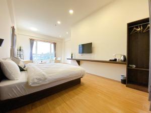 Ein Bett oder Betten in einem Zimmer der Unterkunft 澎湖日記 PenghuDiary