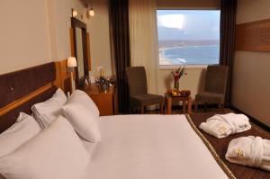 Postel nebo postele na pokoji v ubytování İğneada Resort Hotel & SPA