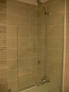 a shower with a glass door in a bathroom at İğneada Resort Hotel & SPA in İğneada
