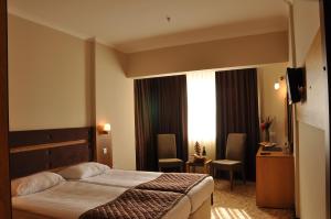 Postel nebo postele na pokoji v ubytování İğneada Resort Hotel & SPA