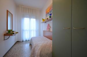 Postel nebo postele na pokoji v ubytování Appartamenti Dal Moro + 11 fotografií