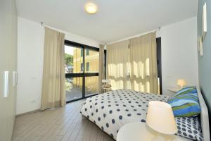 Ένα ή περισσότερα κρεβάτια σε δωμάτιο στο Residenza Serenella