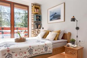Posteľ alebo postele v izbe v ubytovaní Kościelisko Apartament Przy Dolince
