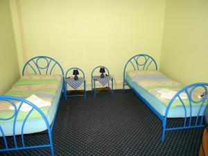 Postel nebo postele na pokoji v ubytování Penzion Paradise
