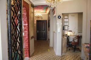 a hallway with a black door and a red wall at Bahaus Guesthouse Hostel in Istanbul