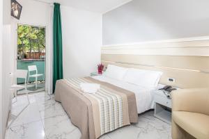 
Postel nebo postele na pokoji v ubytování Hotel Mediterraneo
