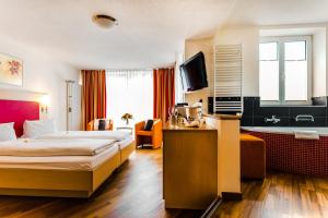Lova arba lovos apgyvendinimo įstaigoje Lifestyle & Spa Hotel Grächerhof