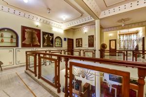 a large museum with a lot of art on the walls at Hotel Radoli House - A Heritage Hotel in Jaipur
