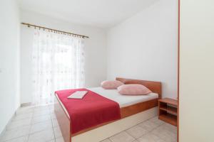 Ένα ή περισσότερα κρεβάτια σε δωμάτιο στο Apartments Neva +21 φωτογραφίες