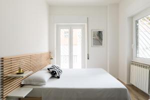A bed or beds in a room at The Vatican TWO