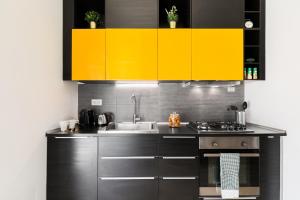 A kitchen or kitchenette at The Vatican TWO