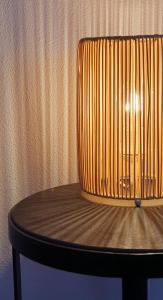 a wooden chair with a lamp on top of it at Arbanella in Corniglia