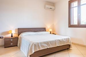 Katil atau katil-katil dalam bilik di Villa Fontanelle Luxury