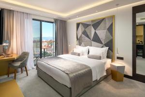 Ліжко або ліжка в номері Time Boutique Hotel