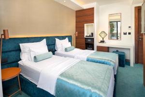 Ліжко або ліжка в номері Time Boutique Hotel