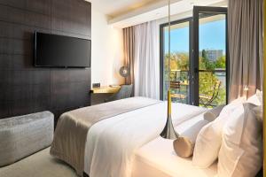 Ліжко або ліжка в номері Time Boutique Hotel