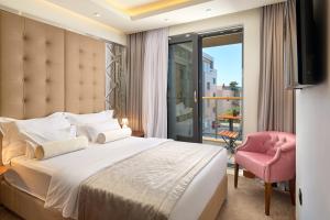 Ліжко або ліжка в номері Time Boutique Hotel