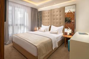Ліжко або ліжка в номері Time Boutique Hotel