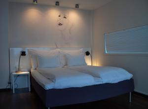 Un pat sau paturi într-o cameră la Comfort Hotel Union Brygge