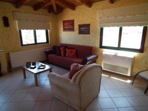 a living room with a couch and a table at Gramvoussa Bay in Kissamos