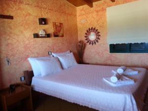 a bedroom with a bed with a cross on it at Gramvoussa Bay in Kissamos