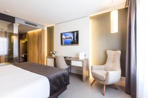 Cama o camas de una habitación en Hotel & Spa Ciudad de Binéfar