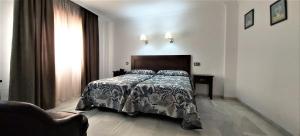 Postel nebo postele na pokoji v ubytování Hotel Averroes + 24 fotografií