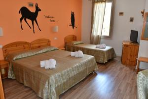 Cama o camas de una habitación en Hotel Saisera
