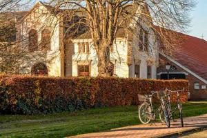 a bike parked in front of a house at Wiemannshof 25191 in Bunde