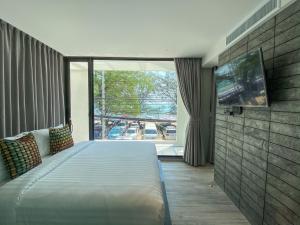 Postel nebo postele na pokoji v ubytování Nirundorn Resort Chaam