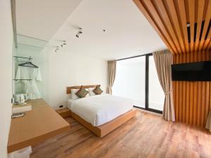Postel nebo postele na pokoji v ubytování Nirundorn Resort Chaam