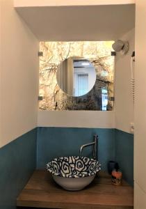 a bathroom with a sink and a mirror at Ca' del Monica in Manarola