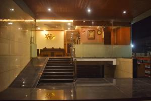 an empty staircase in a building with a stair case at HOTEL CENTRUM in Kota