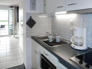 a kitchen with a sink and a mixer on a counter at Apartment B 97 by Interhome in Dittishausen