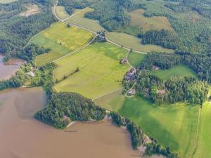 an aerial view of a park next to a river at Holiday Home Peltosirkku by Interhome in Hirsjärvi