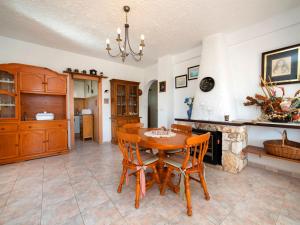 a kitchen and dining room with a table and chairs at Holiday Home Meluca by Interhome in Calpe