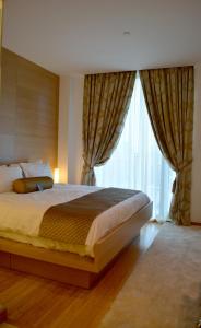 Postel nebo postele na pokoji v ubytování The One Boutique Hotel