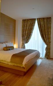 Katil atau katil-katil dalam bilik di The One Boutique Hotel