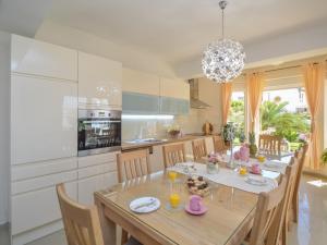 a kitchen and dining room with a table and chairs at Holiday Home Valdor by Interhome in Sovlje
