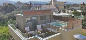 a house with a swimming pool on top of it at Blueonar in Chania Town