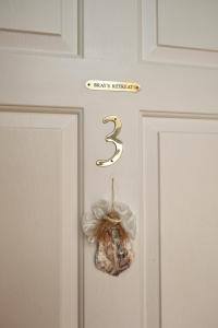 a door with a christmas ornament on it at Captain Farris House in South Yarmouth