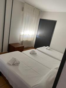 Postel nebo postele na pokoji v ubytování Hostal San Andrés