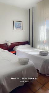 Postel nebo postele na pokoji v ubytování Hostal San Andrés